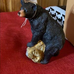 Bear on logs and rocks